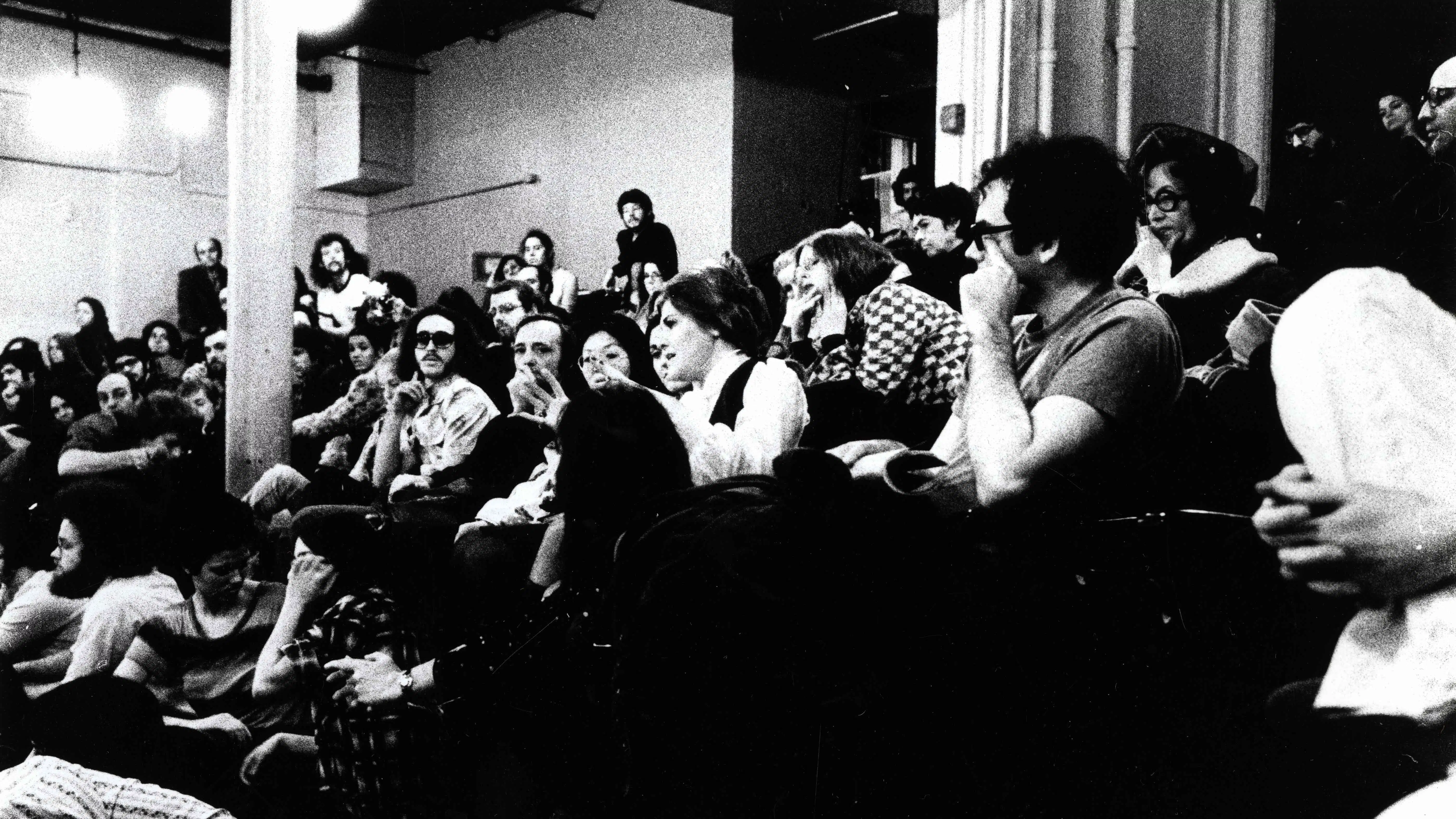 black and white photo of students in auditorium