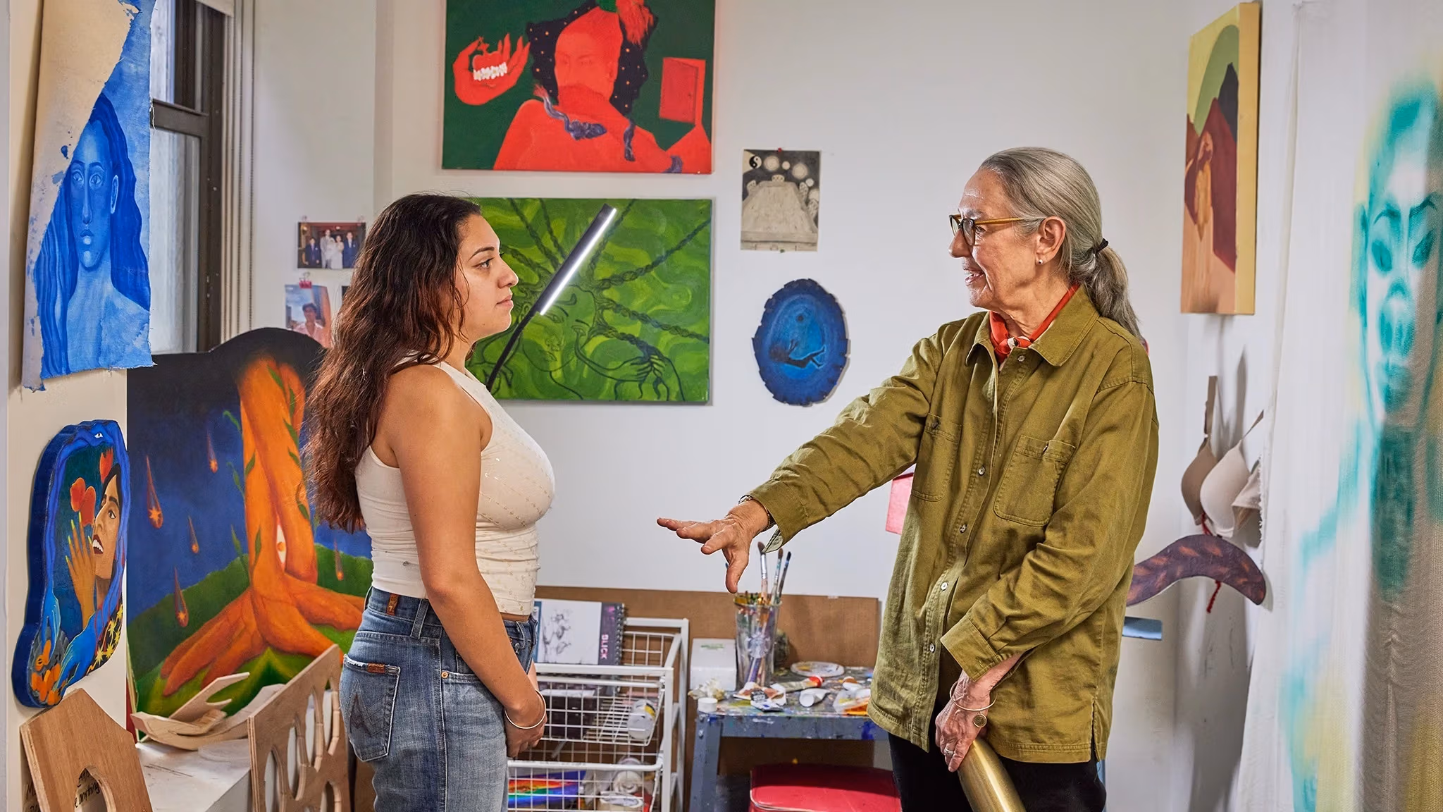 Shot of a student and teacher discussing work in the senior studio
