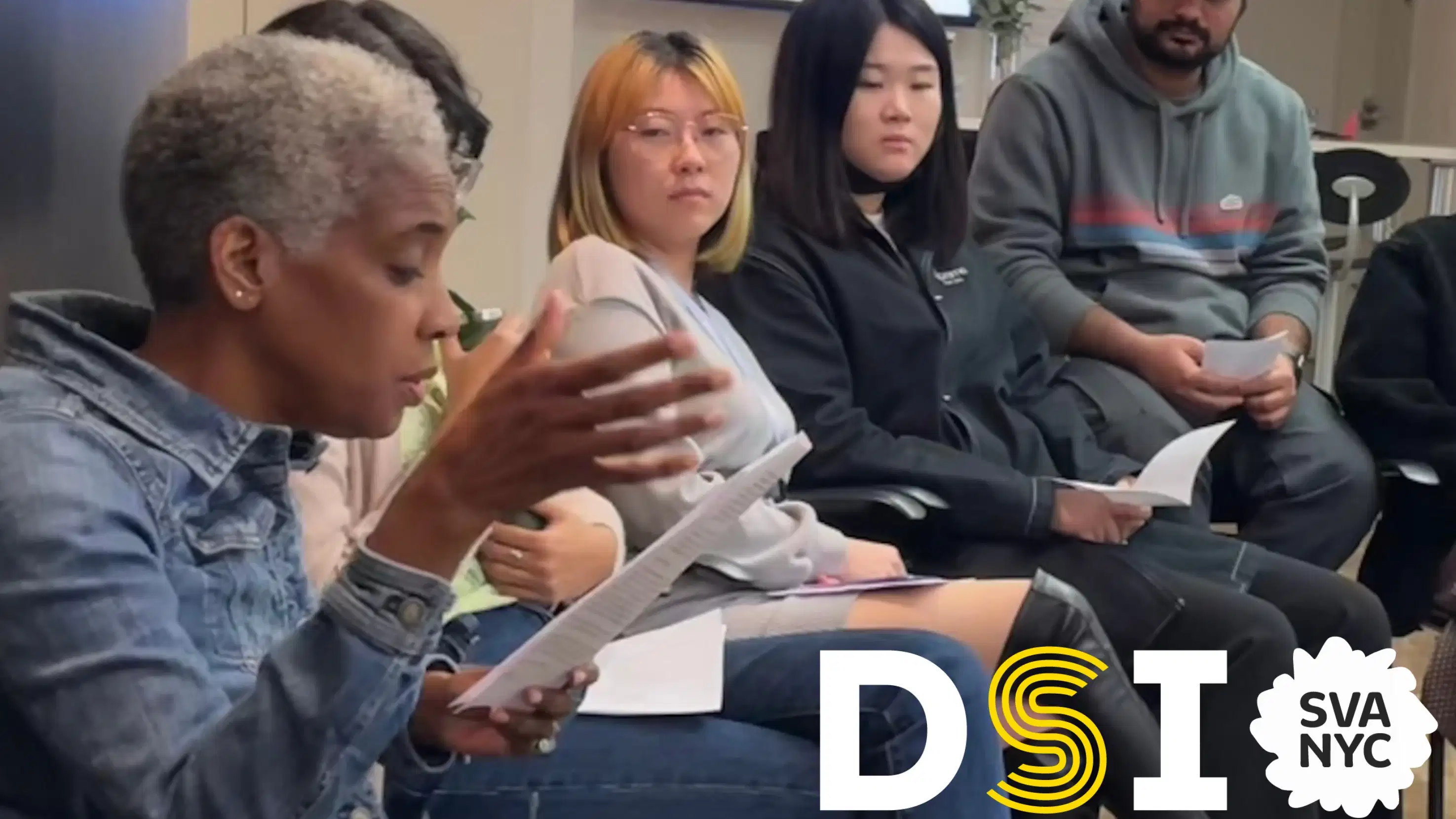 image of person speaking and students listening.