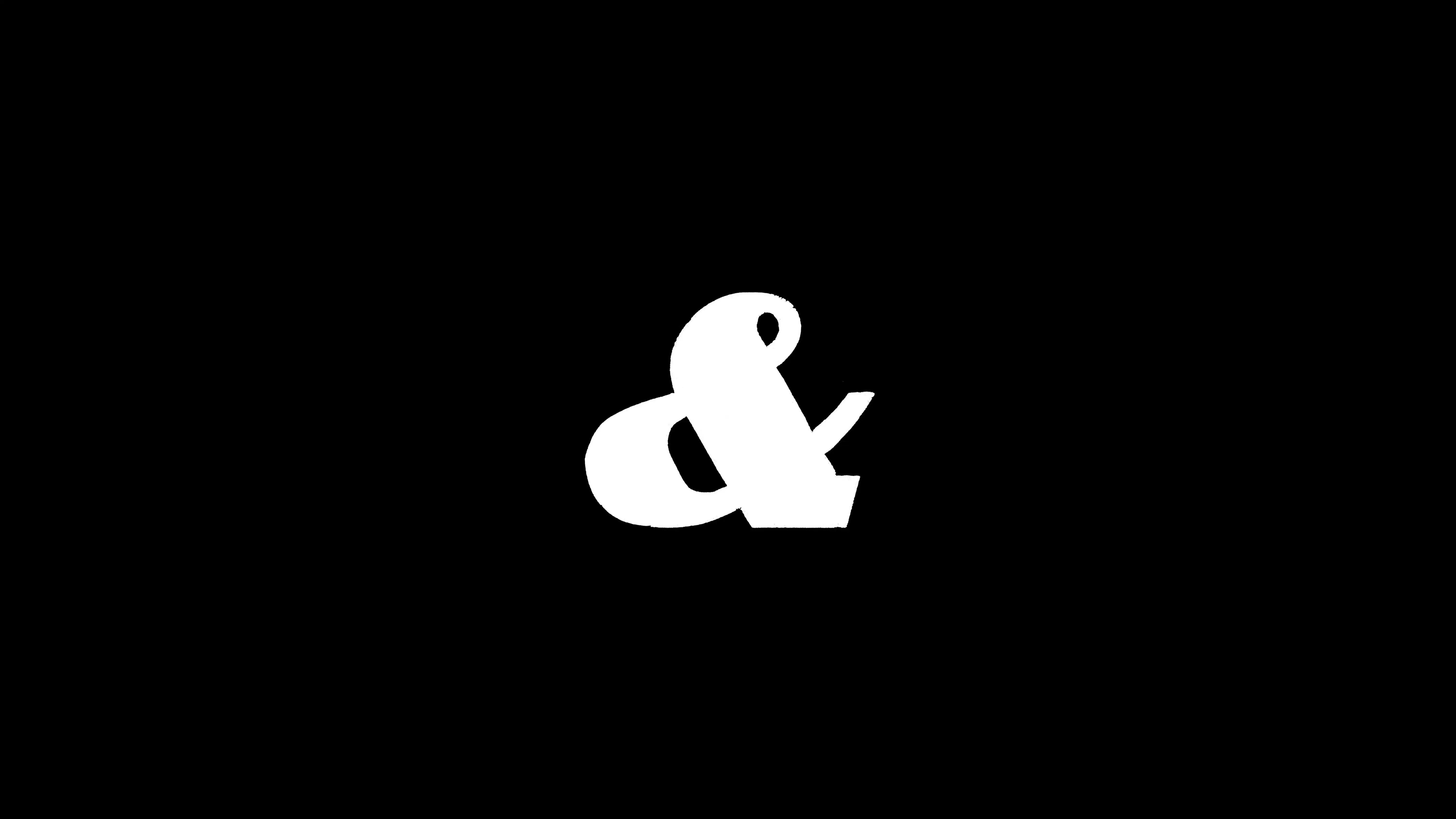 White ampersand on a black background