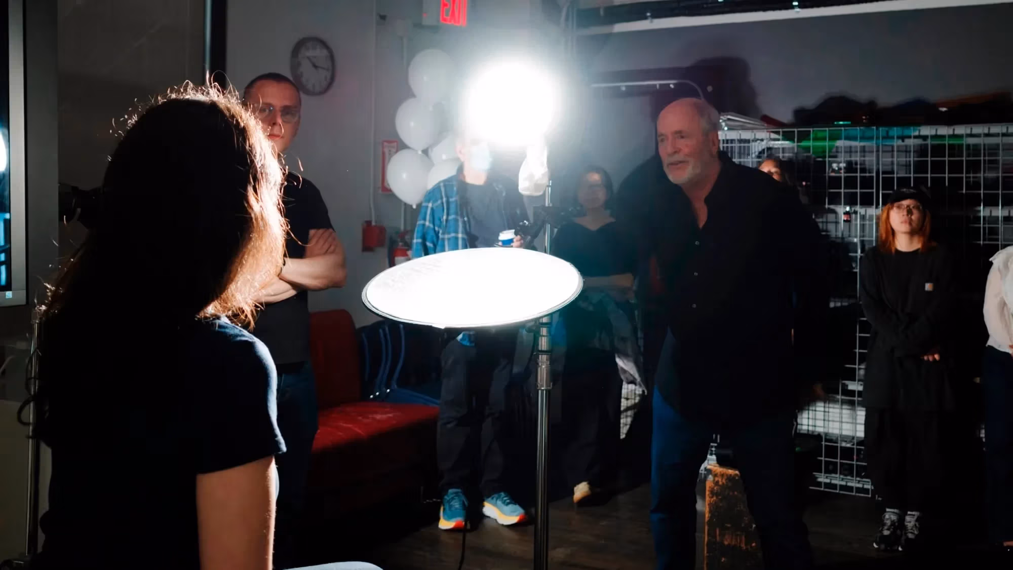 A photo from a lighting workshop with Greg Gorman, where one of our student is modeling for the class to demonstrate lighting techniques.