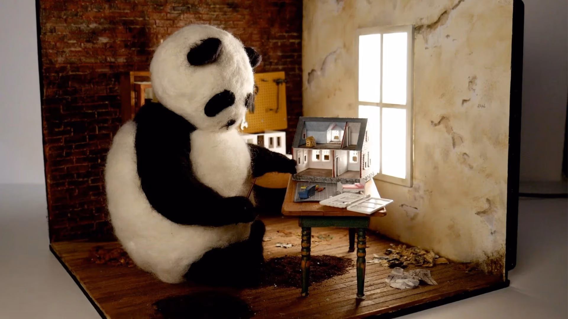 panda bear sitting in a house