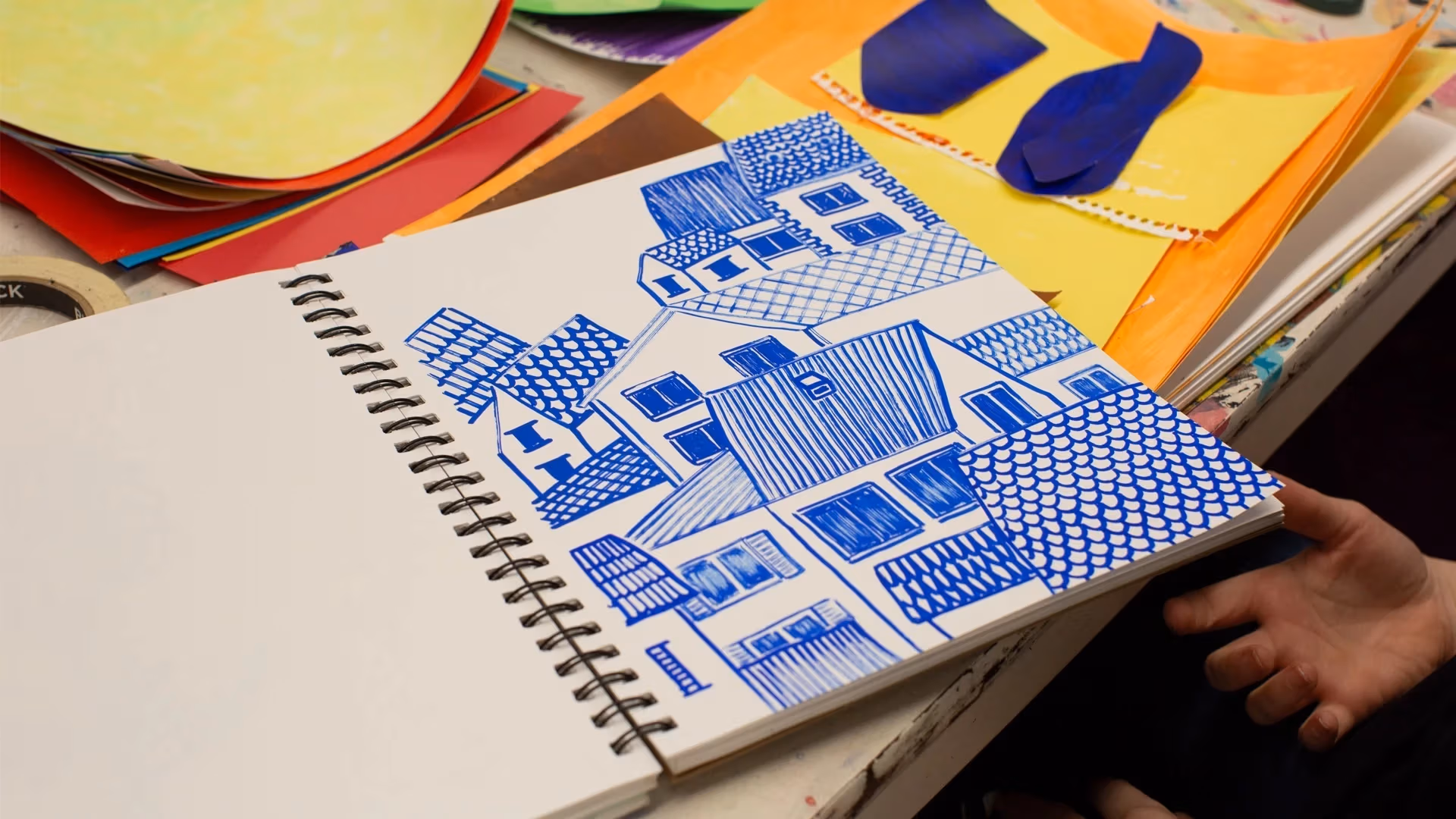drawing of a cluster of houses in the color blue