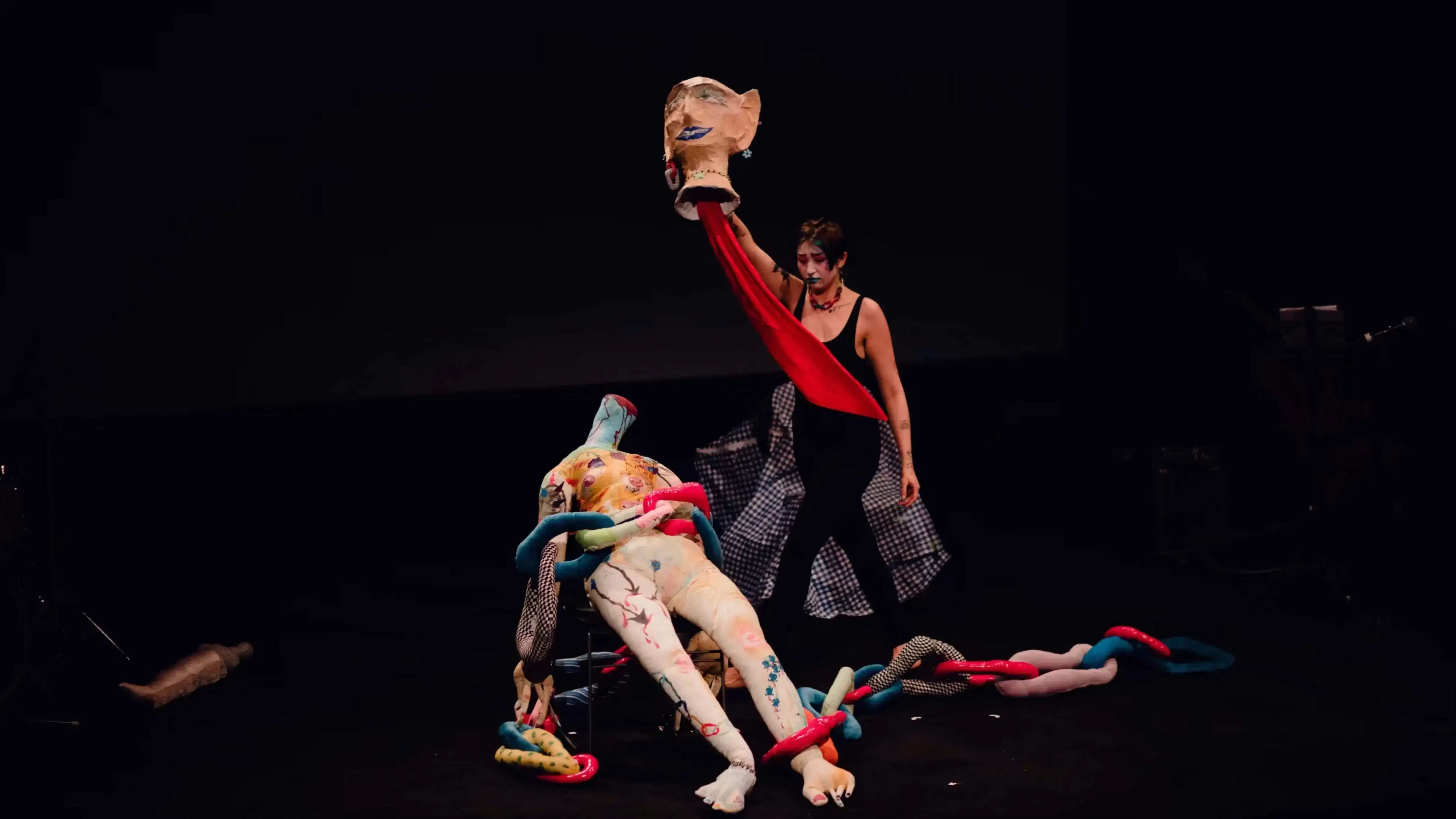 SVA student performing on stage with self made props