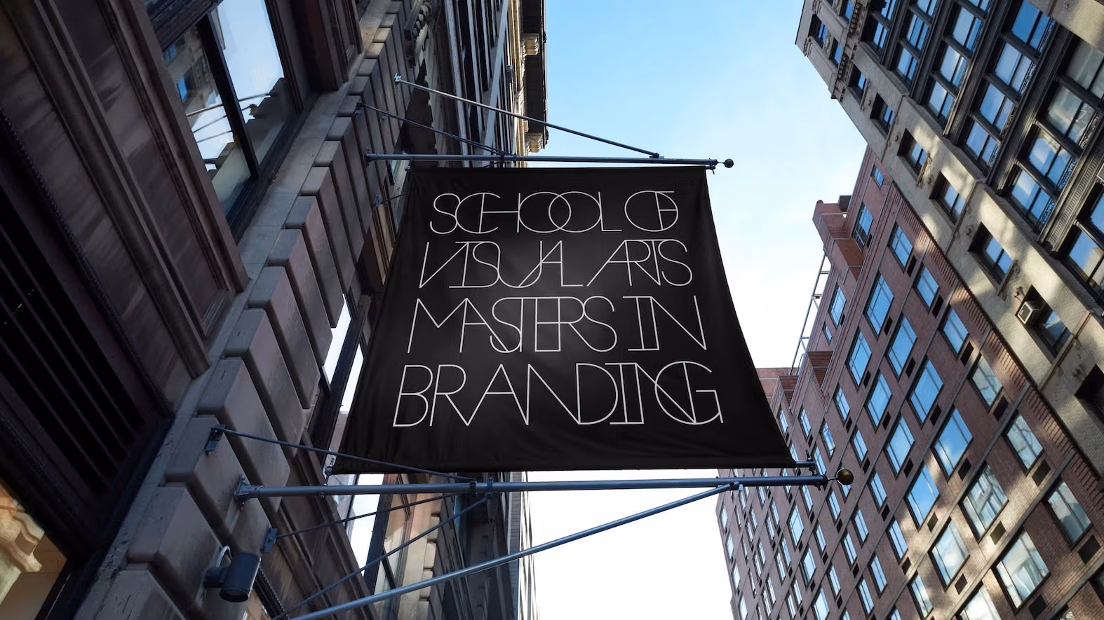 Photograph of a banner outside a Manhattan building that says "School of Visual Arts Masters In Branding"