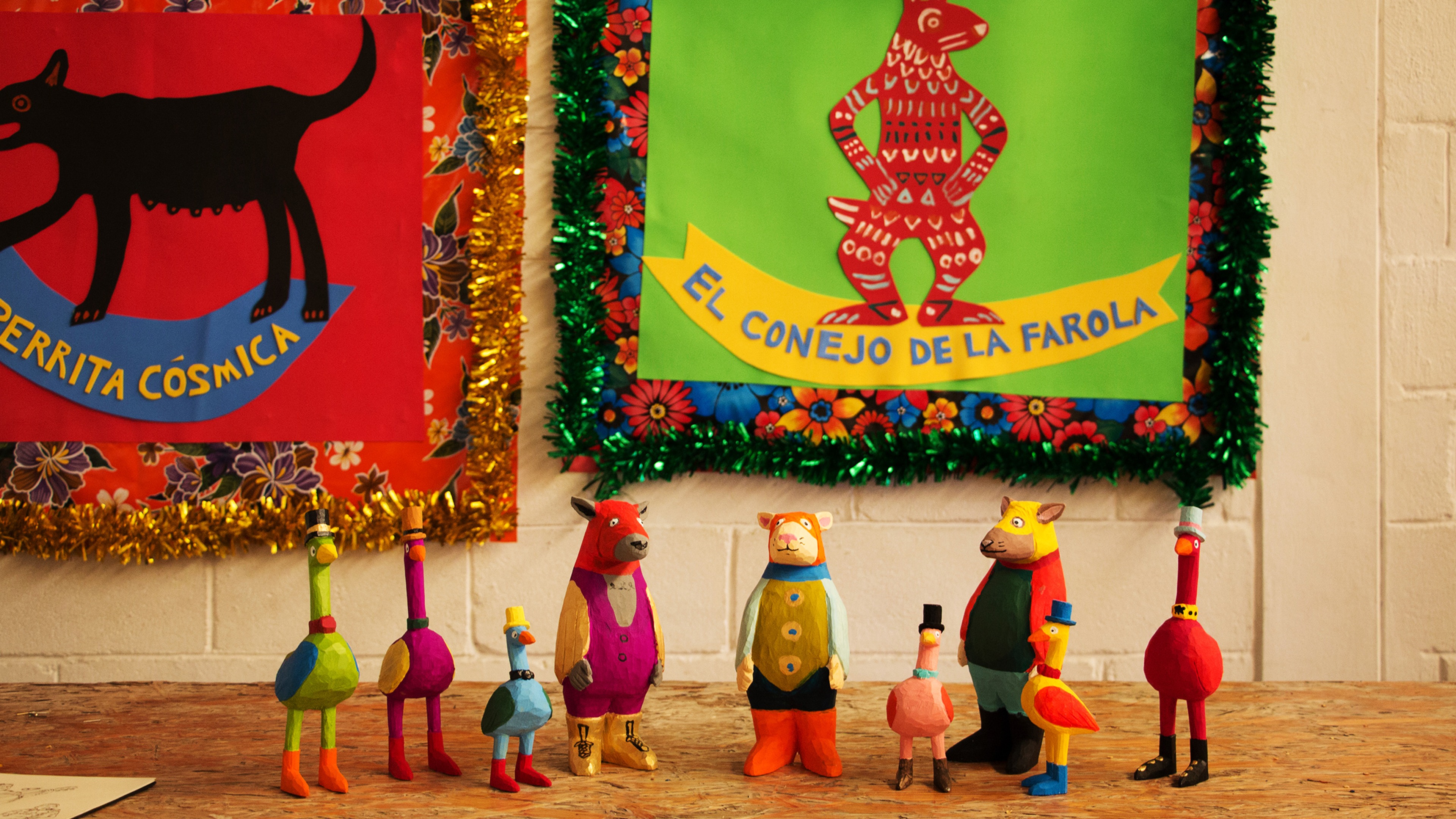 Small colorful figurines created by Students on view in the shared studio space in Oaxaca, Mexico.