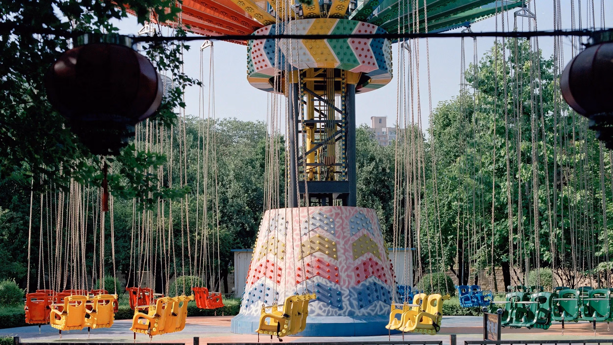 In summer 2022, I revisited the amusement park of my childhood. Many rides were abandoned; others neglected. Drawn to my favorite swing ride, I stood, awash with nostalgia. Though much had changed, echoes of my younger self lingered, anchored in those carefree afternoons.