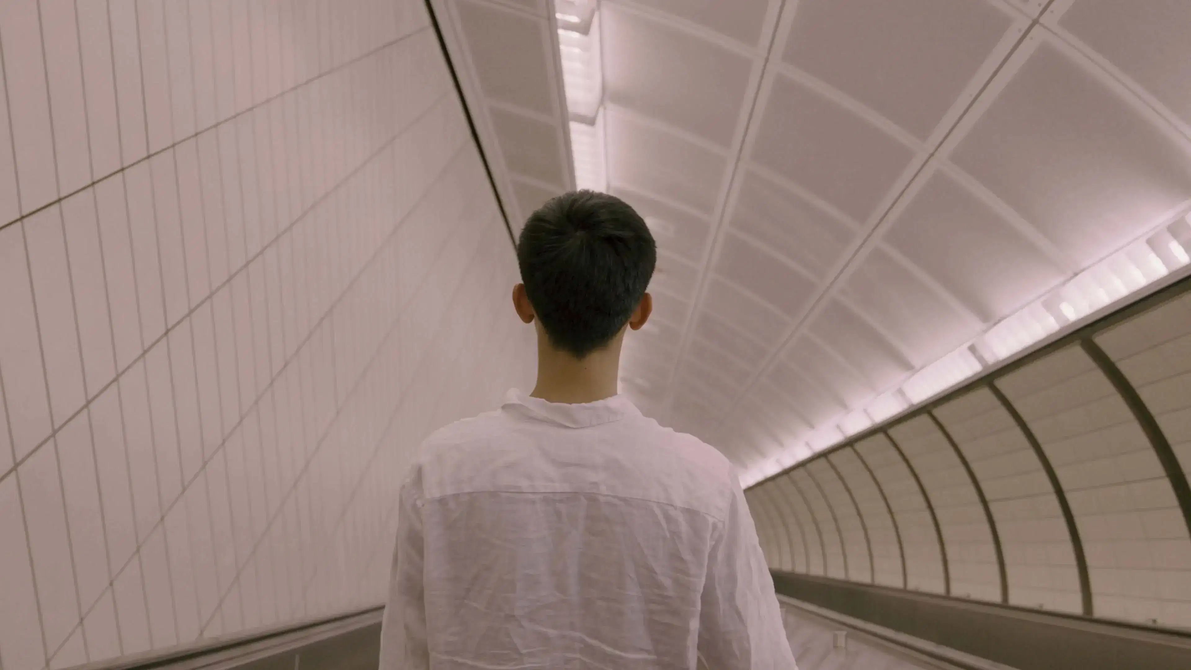 A boy wandering in the subway station.