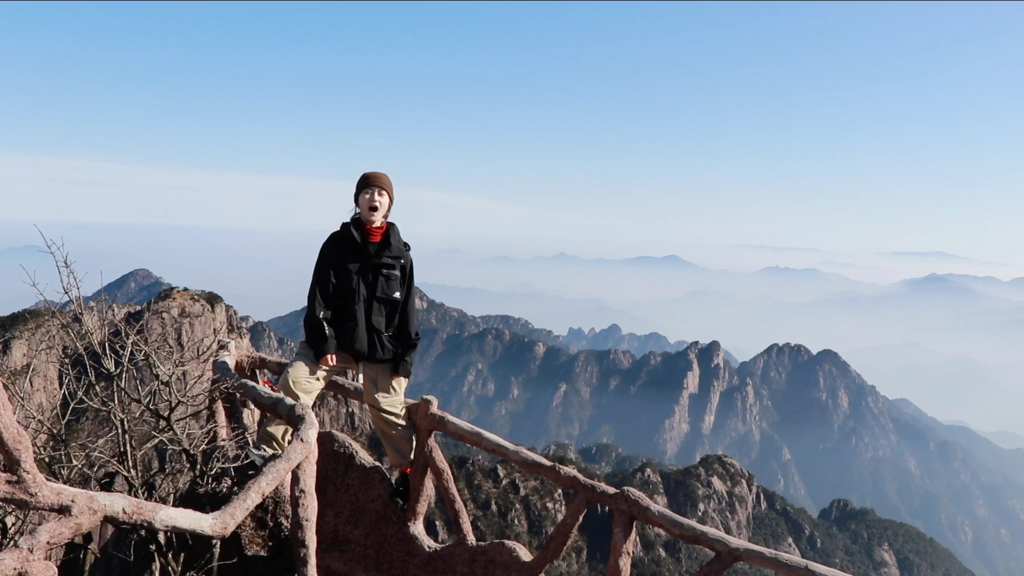 photo of the artist screaming in the mountains