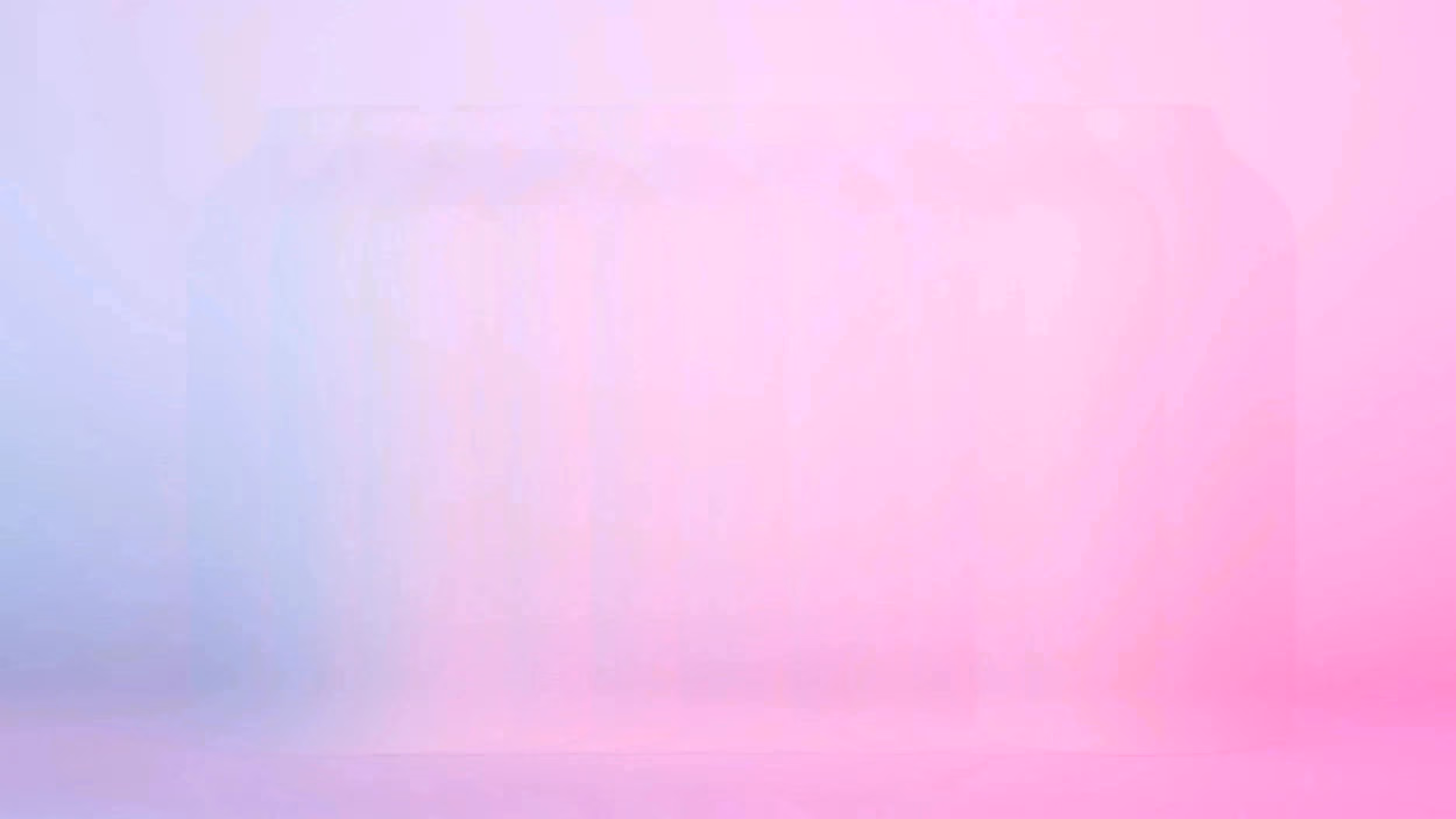 A vase on a white backdrop that is lit by a blue light and a magenta light