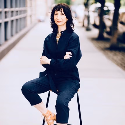 Anita Zeppetelli sitting on a stool