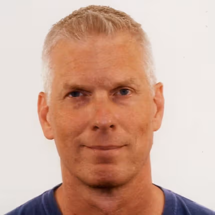 smiling man in t shirt