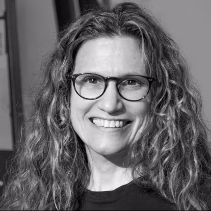 black and white photo of Sharon Louden smiling 