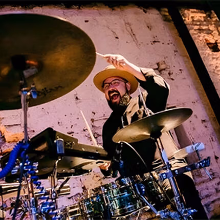 Javier Cruz playing drums. 