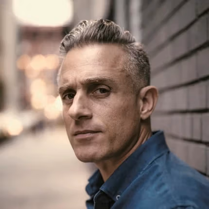 Portrait of Miguel Luciano with blurred background 