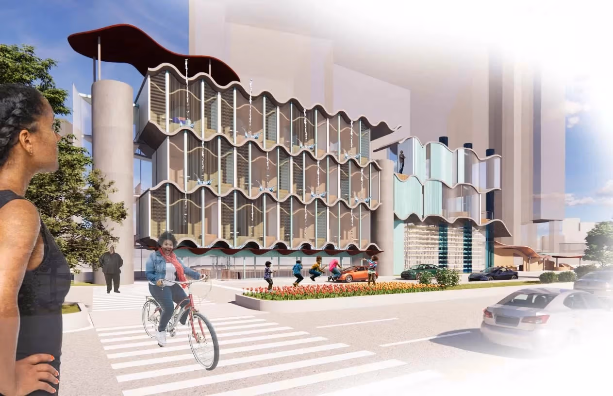 A street view of a modern housing facility and building complex in Manhattan near the river.