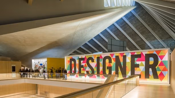 A large sign with the word "DESIGNER"