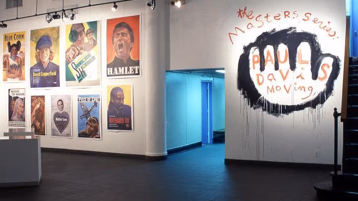 An expression of neatness and grafitti on two poles