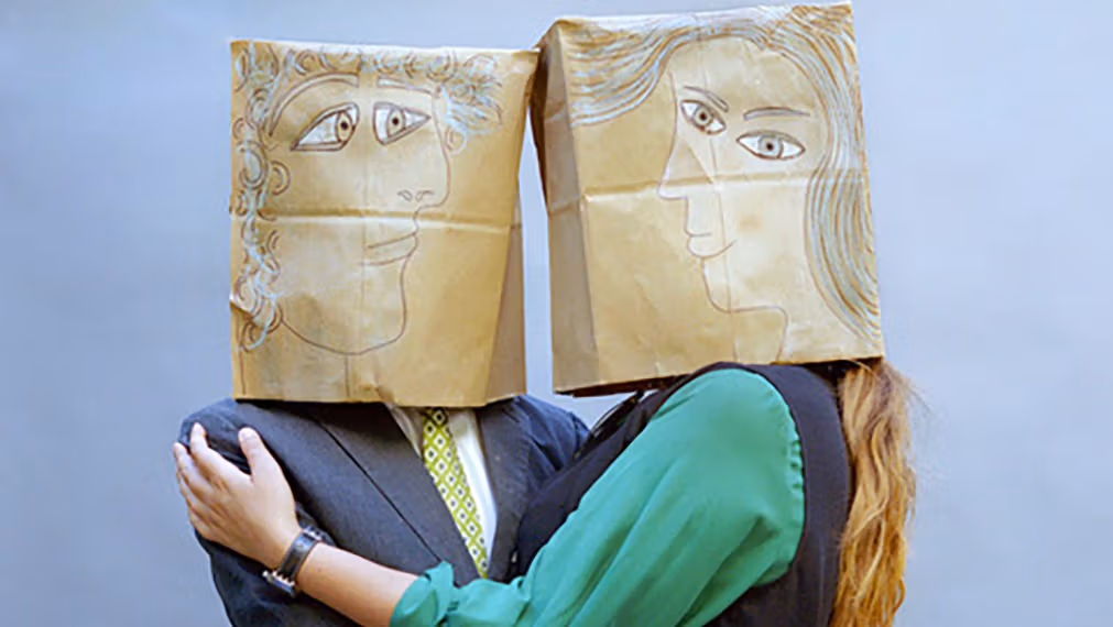 people with bags on head