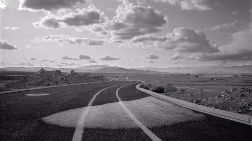 A picture of a winding road in a desert