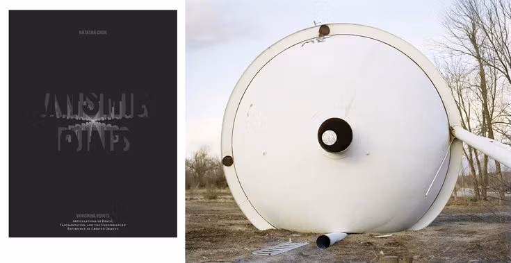 A book cover next to a fallen over water tower