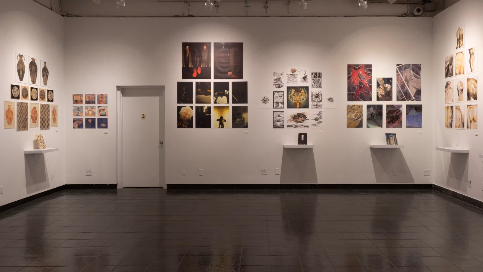 Primary view from inside SVA Gramercy Gallery with three walls visible, covered in brightly-colored illustrated panels and grouped by each respective artist.