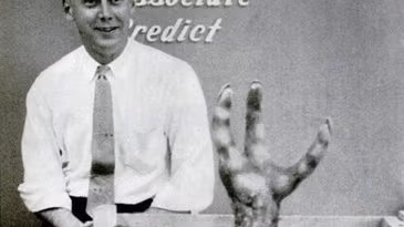 The alien hand reaches out of the box.