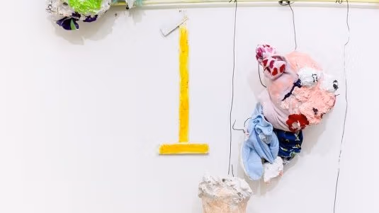 Artistic sculptures haning on a wire frame