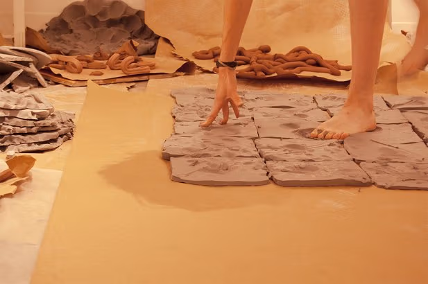 Mia Schachter, "The Limitations of My Left Foot," performance with clay**