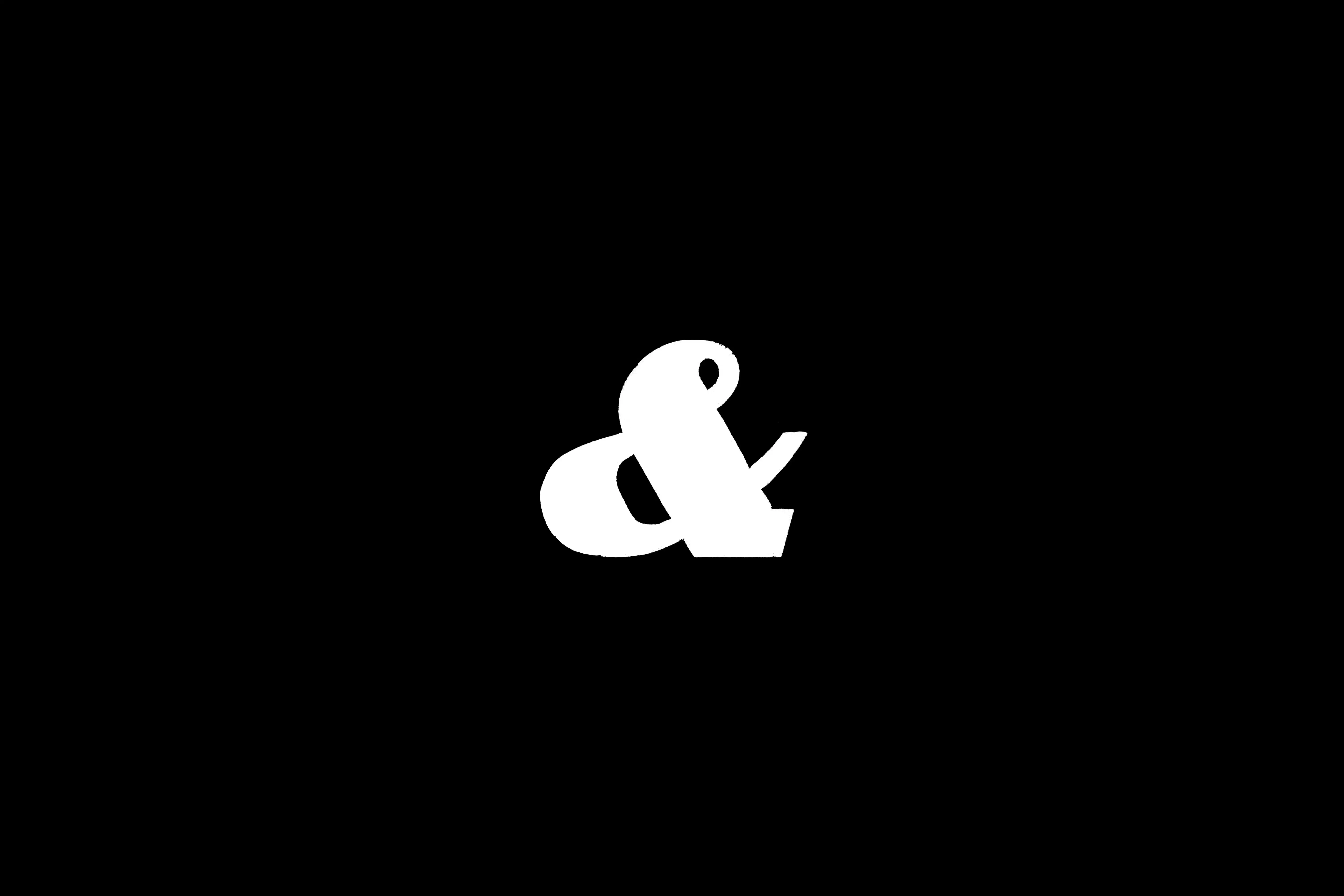 White ampersand on a black background