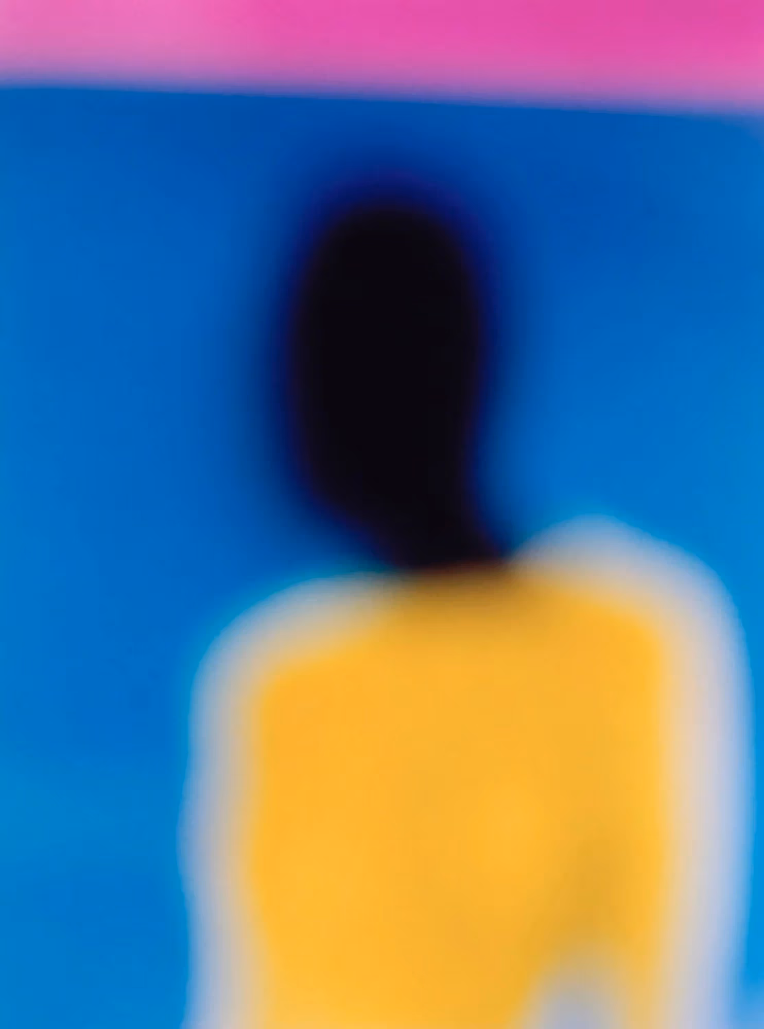 a yellow, blue and magenta portrait of a figure with a dark face.