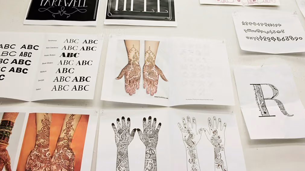 Photo of pictures of henna tattoos on hands and arms.