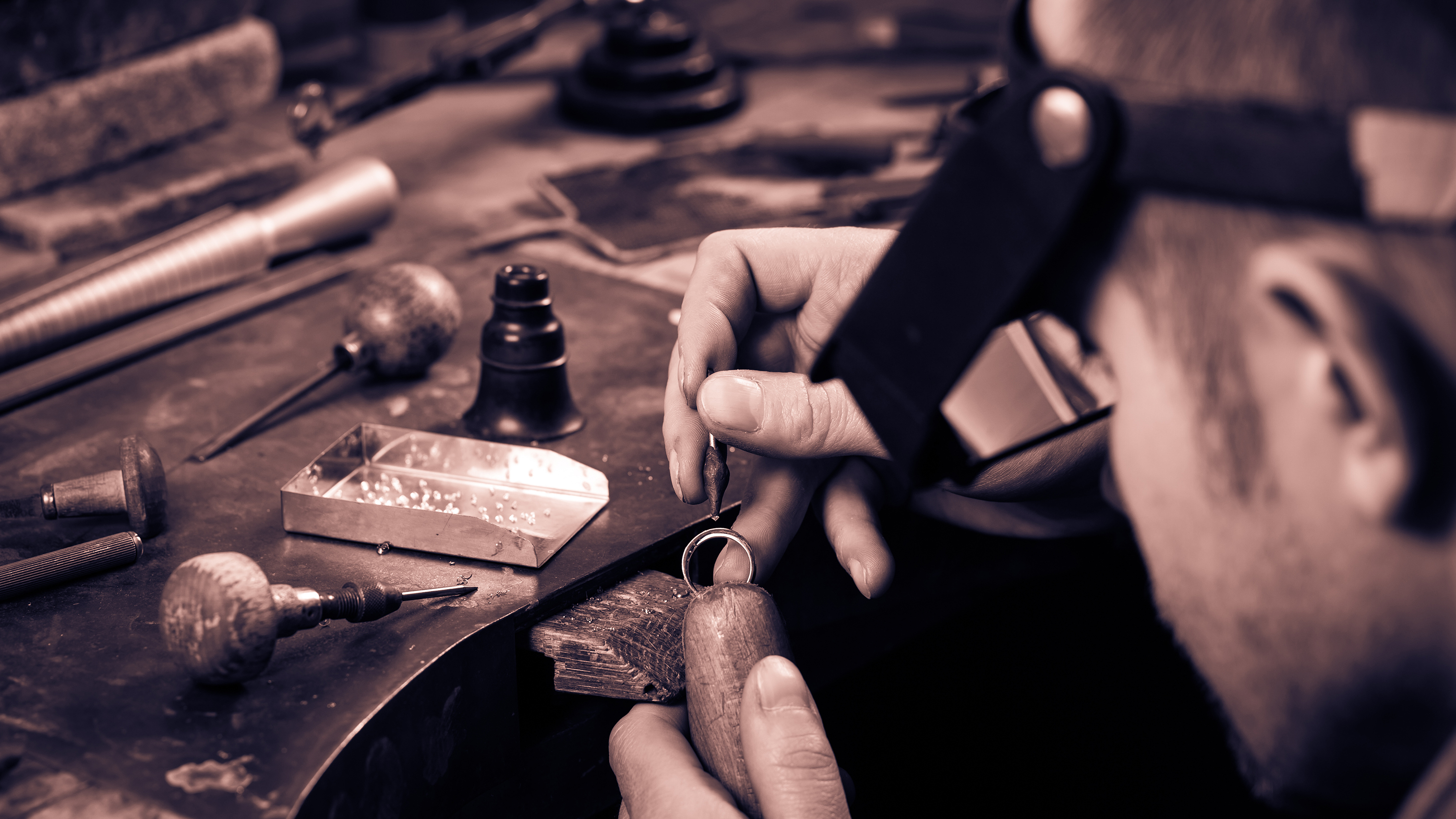 person working on jewelry