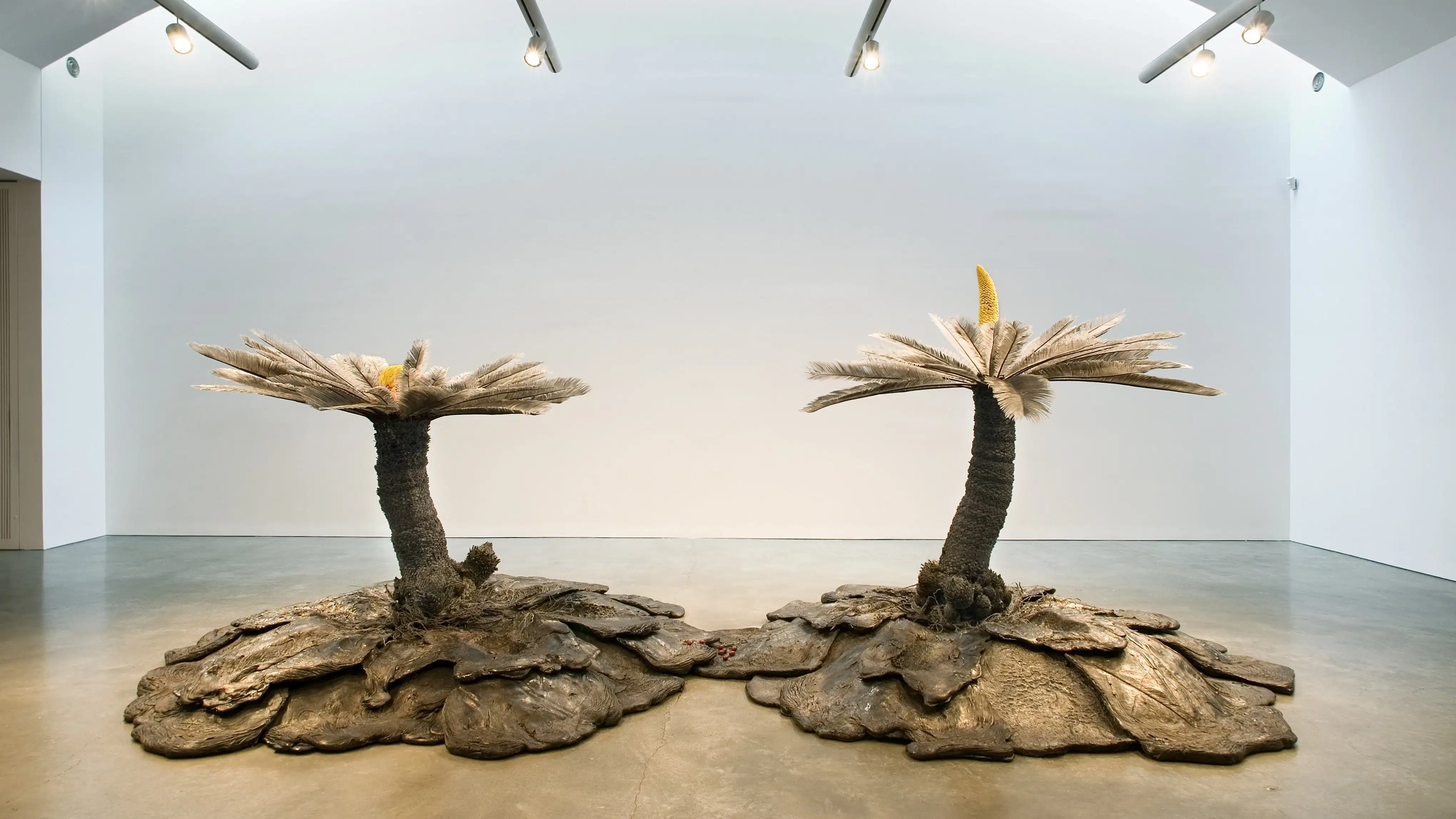 Keith Edmier, Cycas Orogeny, 2003-2004 basalt, polyurethane, acrylic paint, and Cycas revoluta pollen. 88 1/2 x 247 3/4 x 123 1/4 inches.  