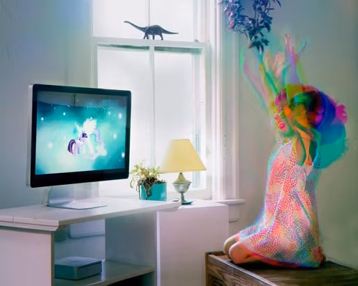 Girl watching a unicorn on her t.v. The girl on the right is moving and smiling.