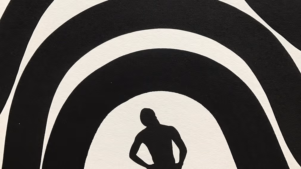 person looking up at arches