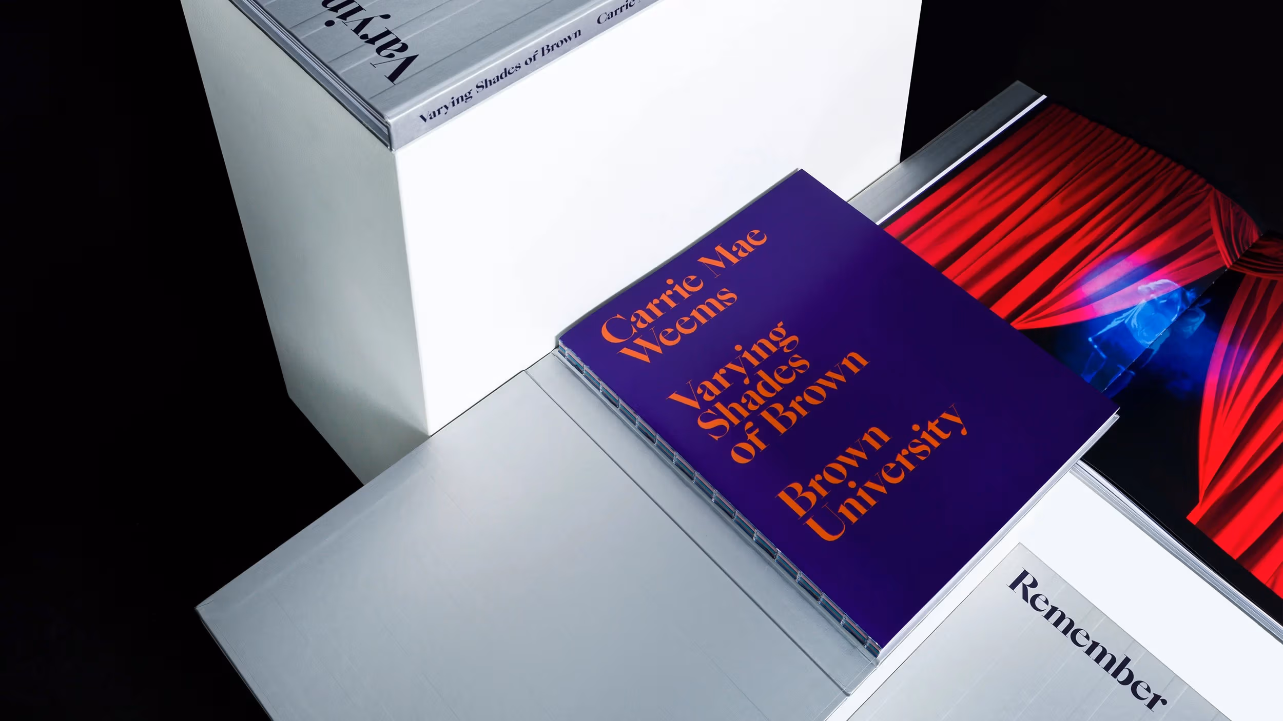 An assortment of books by Carrie Mae Weems called Varying Shades of Brown 