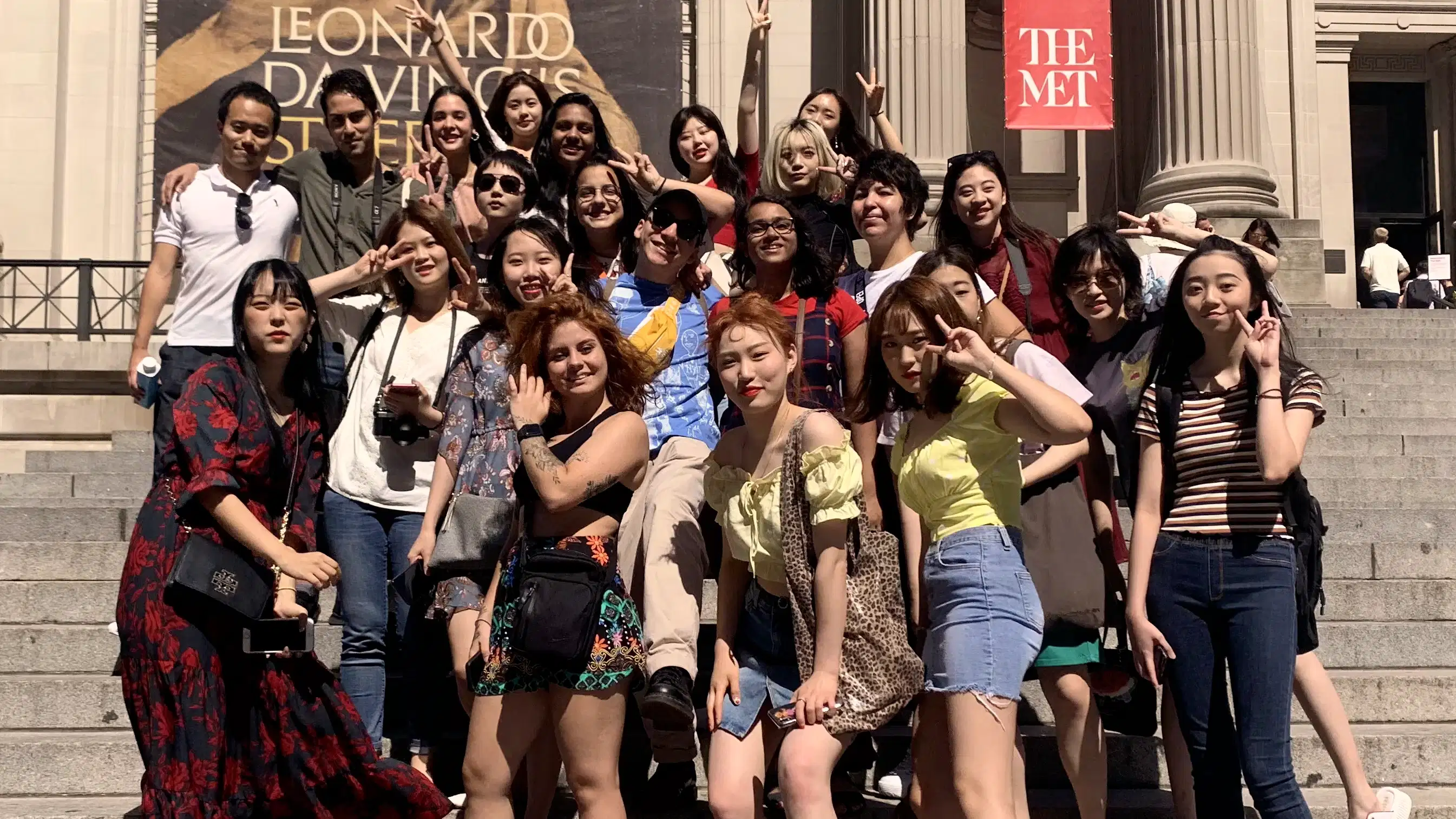 Students pose for a group photo on the iconic steps in front of the Metropolitan Museum of Art.