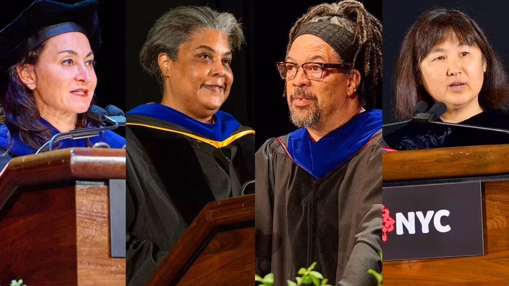 Four graduate speakers in caps and gowns stand at podiums during a graduation ceremony, celebrating their academic achievements.