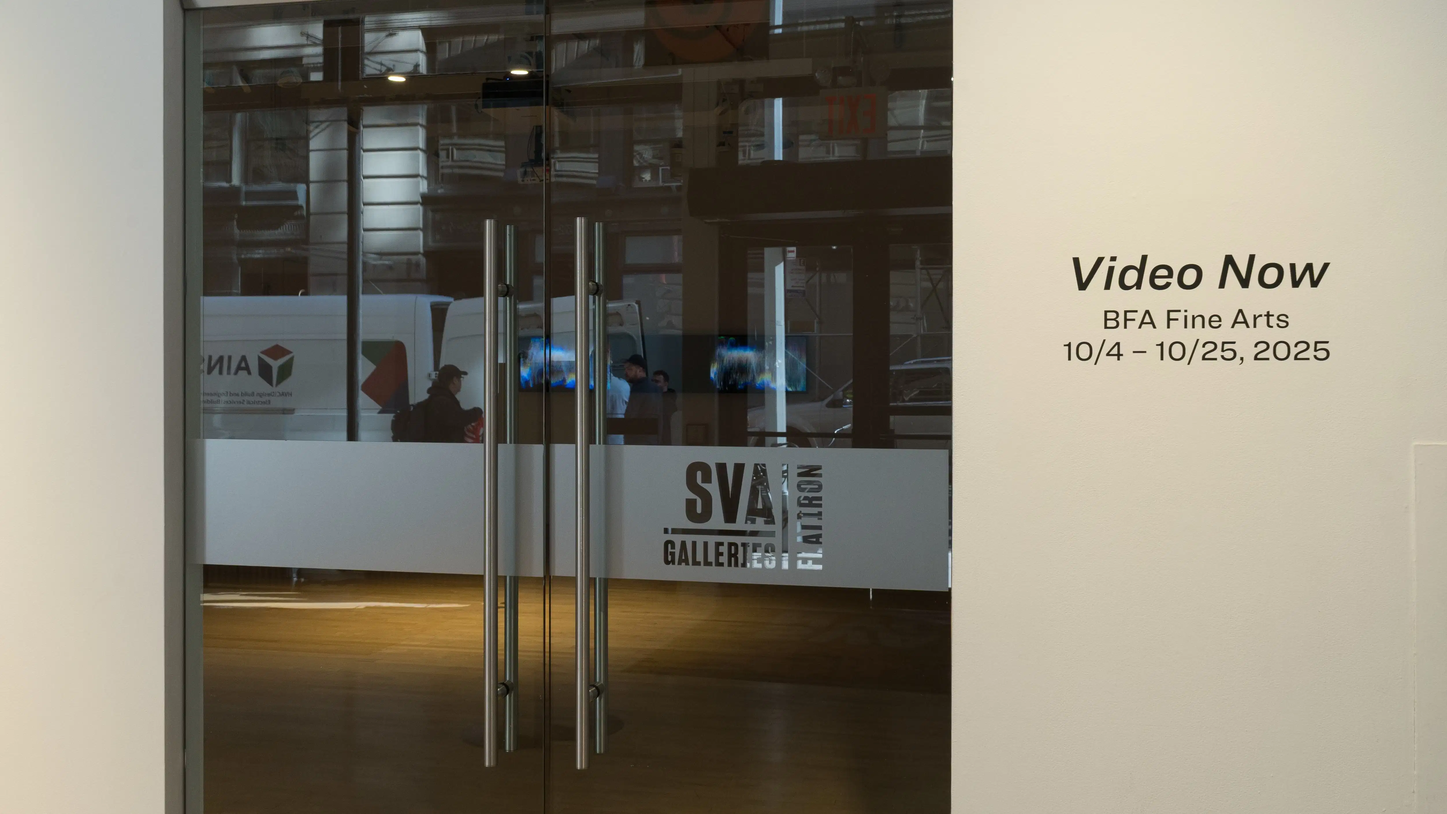 External view of the gallery, with the exhibition title "Video Now" on the right-hand wall beside double glass doors.