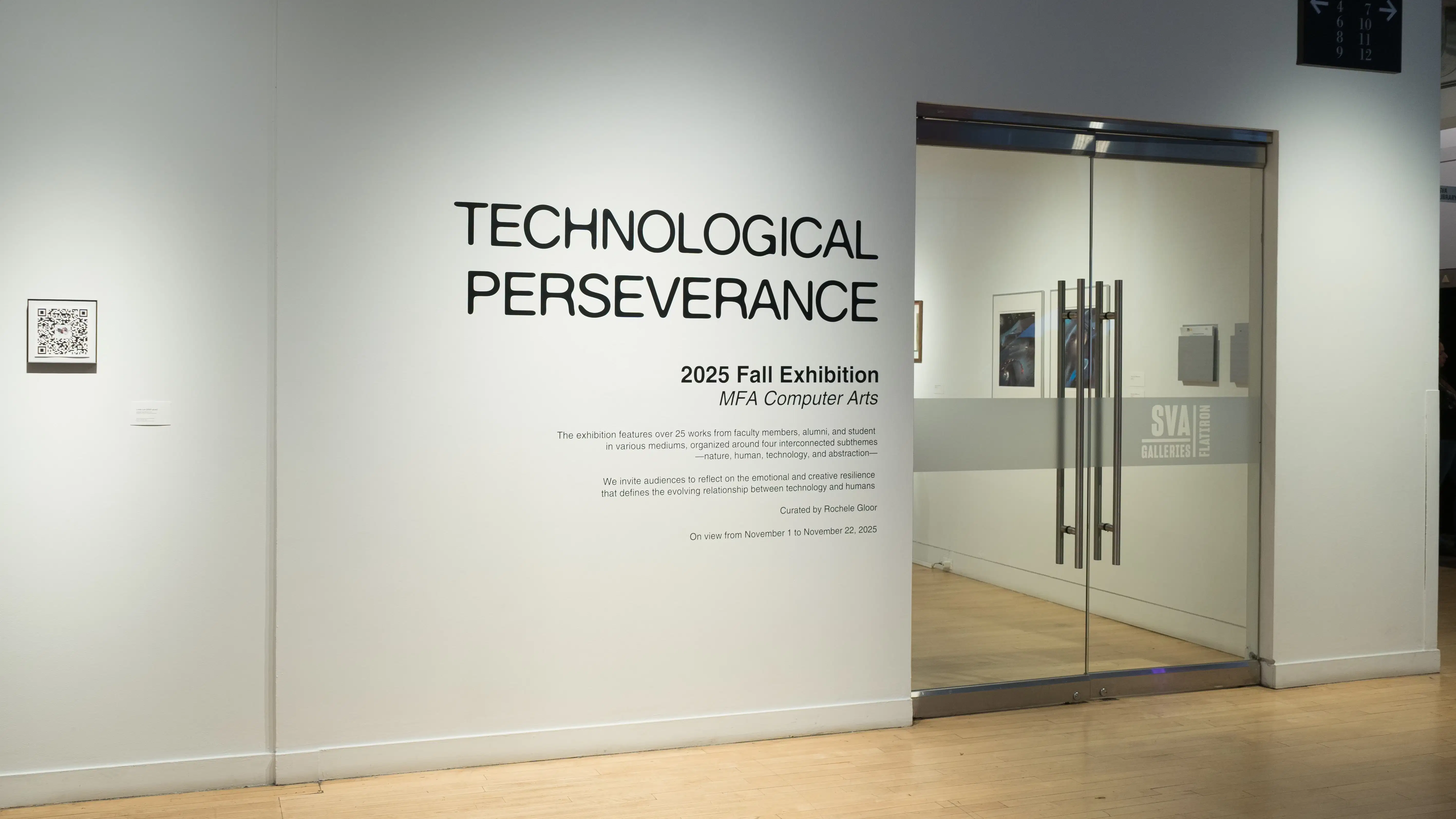 In the gallery alcove, outside of the glass doors, the wall text reads “Technological Perseverance / 2025 Fall Exhibition / MFA Computer Arts.”