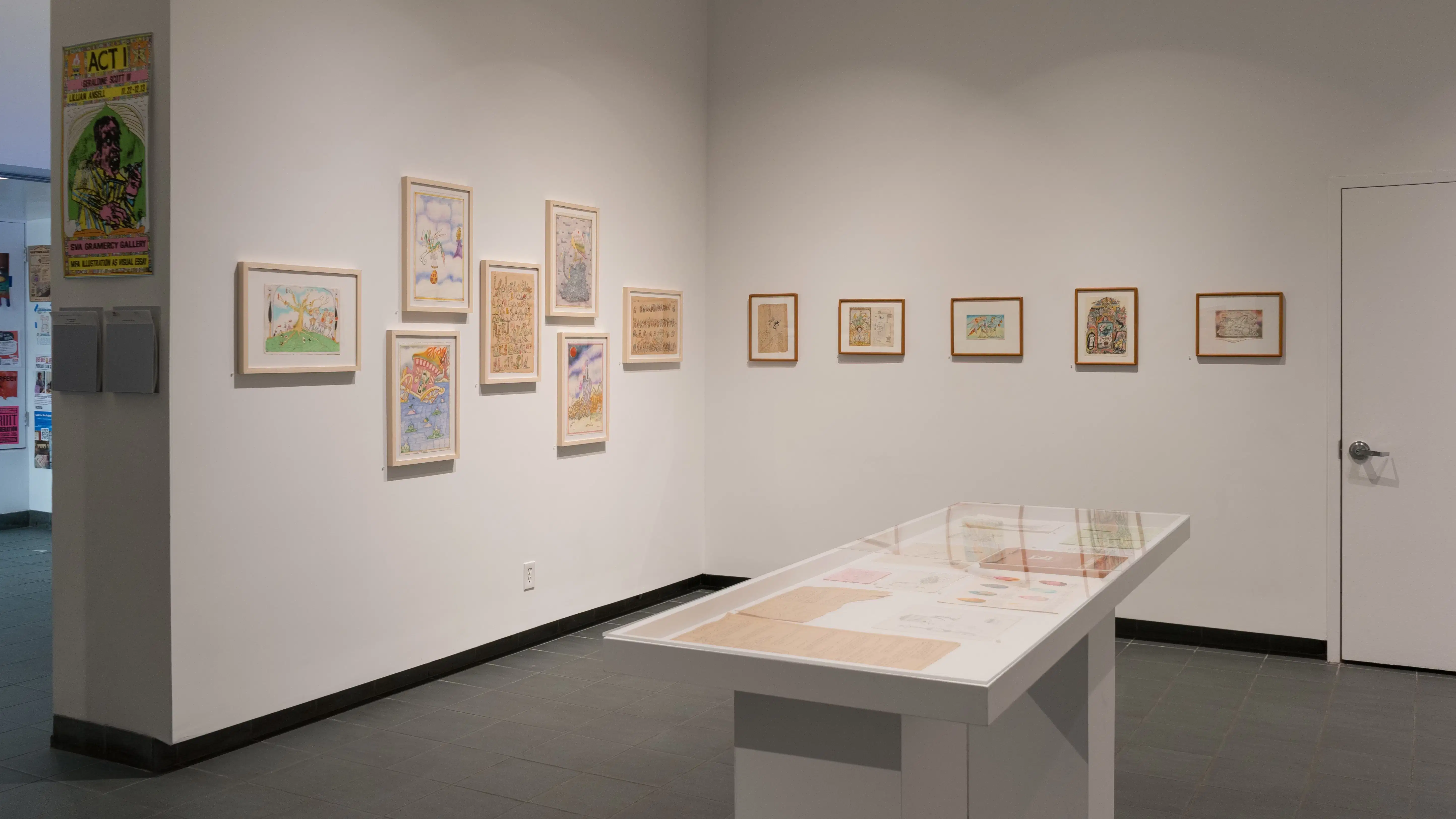 In the lobby of the SVA Gramercy Gallery, framed illustrations by Lillian Ansel are displayed on the walls. In the center of the floor, a vitrine holds loose papers.