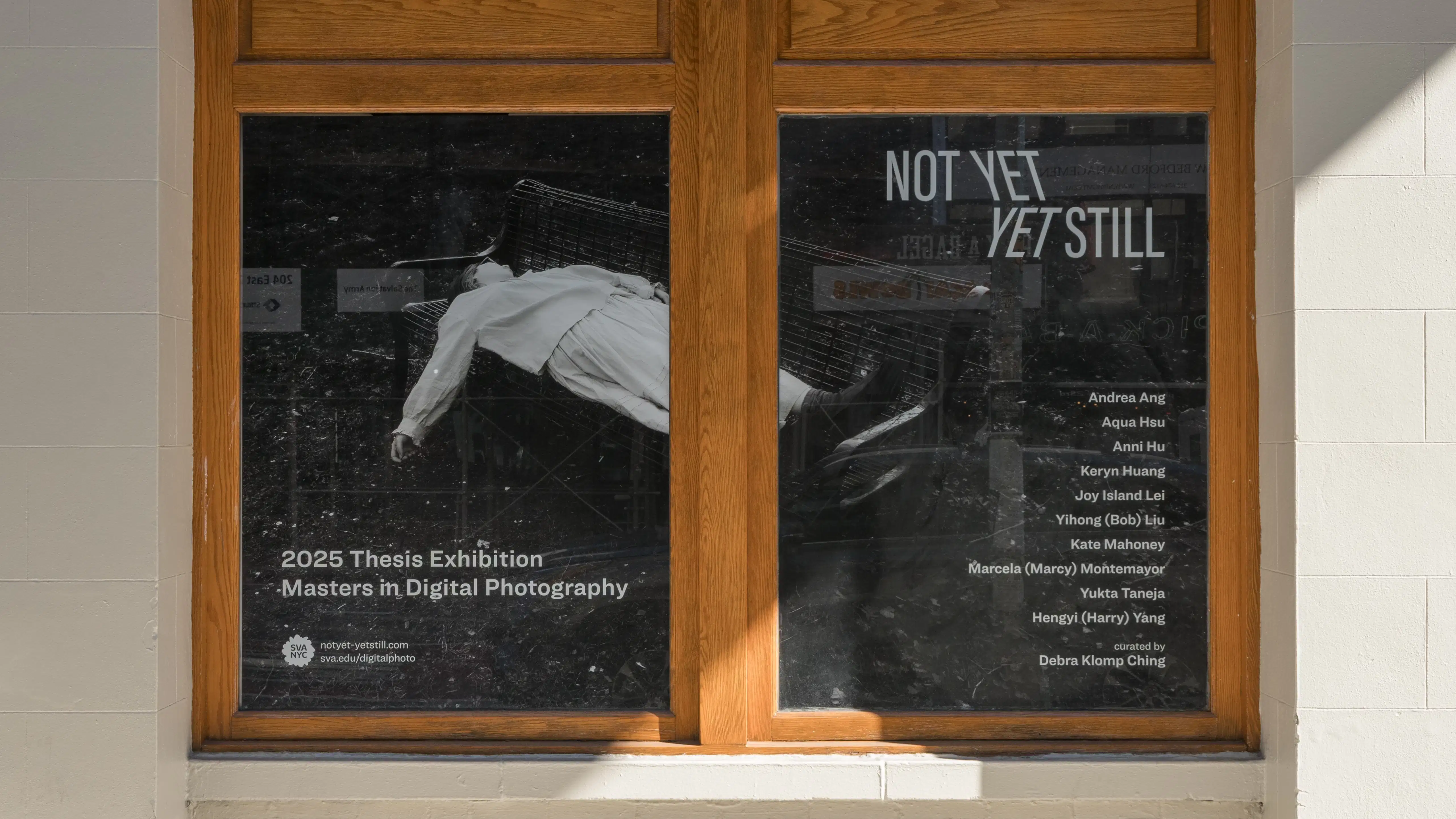 The exterior window of SVA’s Gramercy Gallery, with the exhibition title and poster reading the artists’ names.