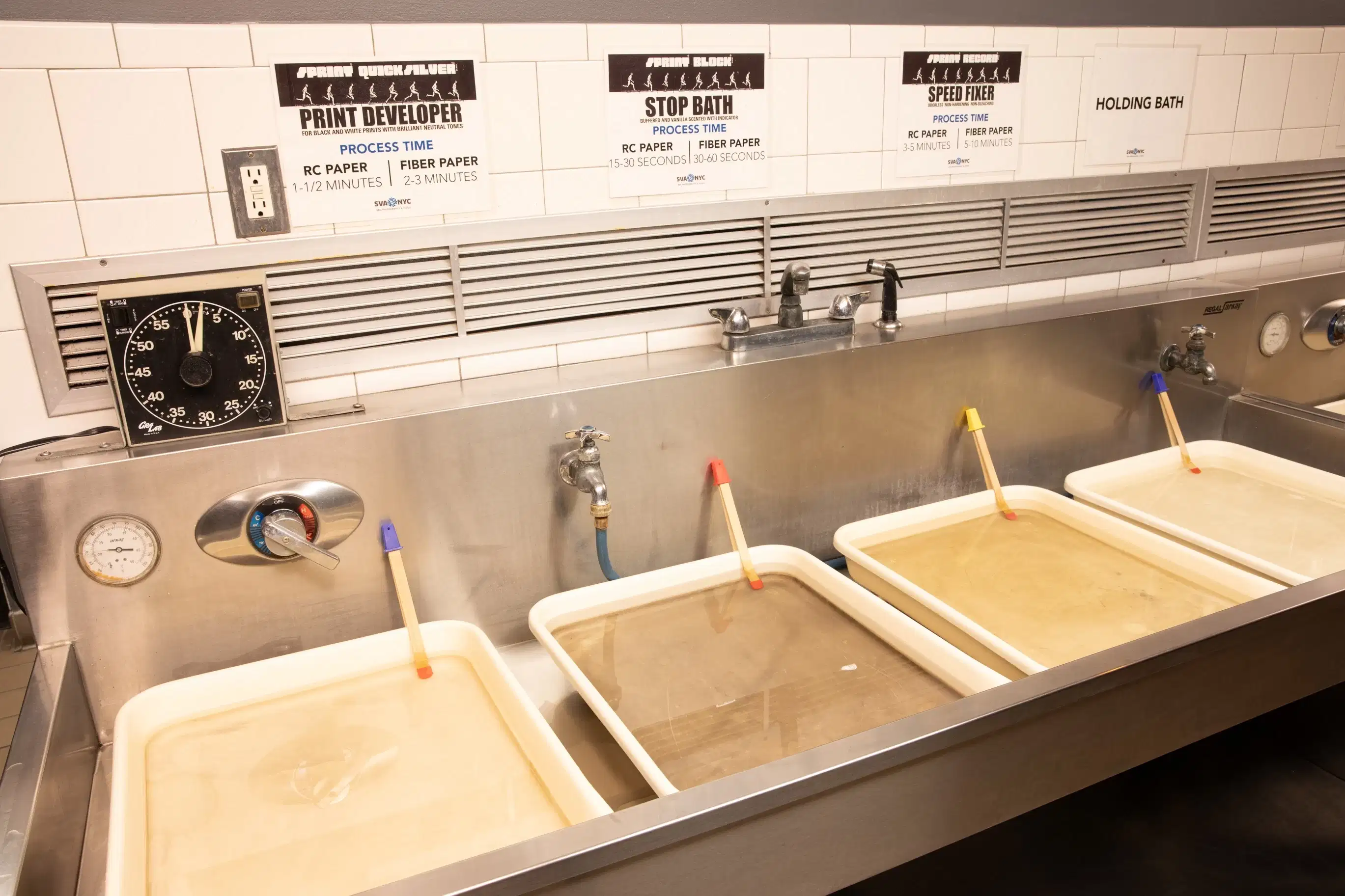 A sink with tubs of film developing chemicals