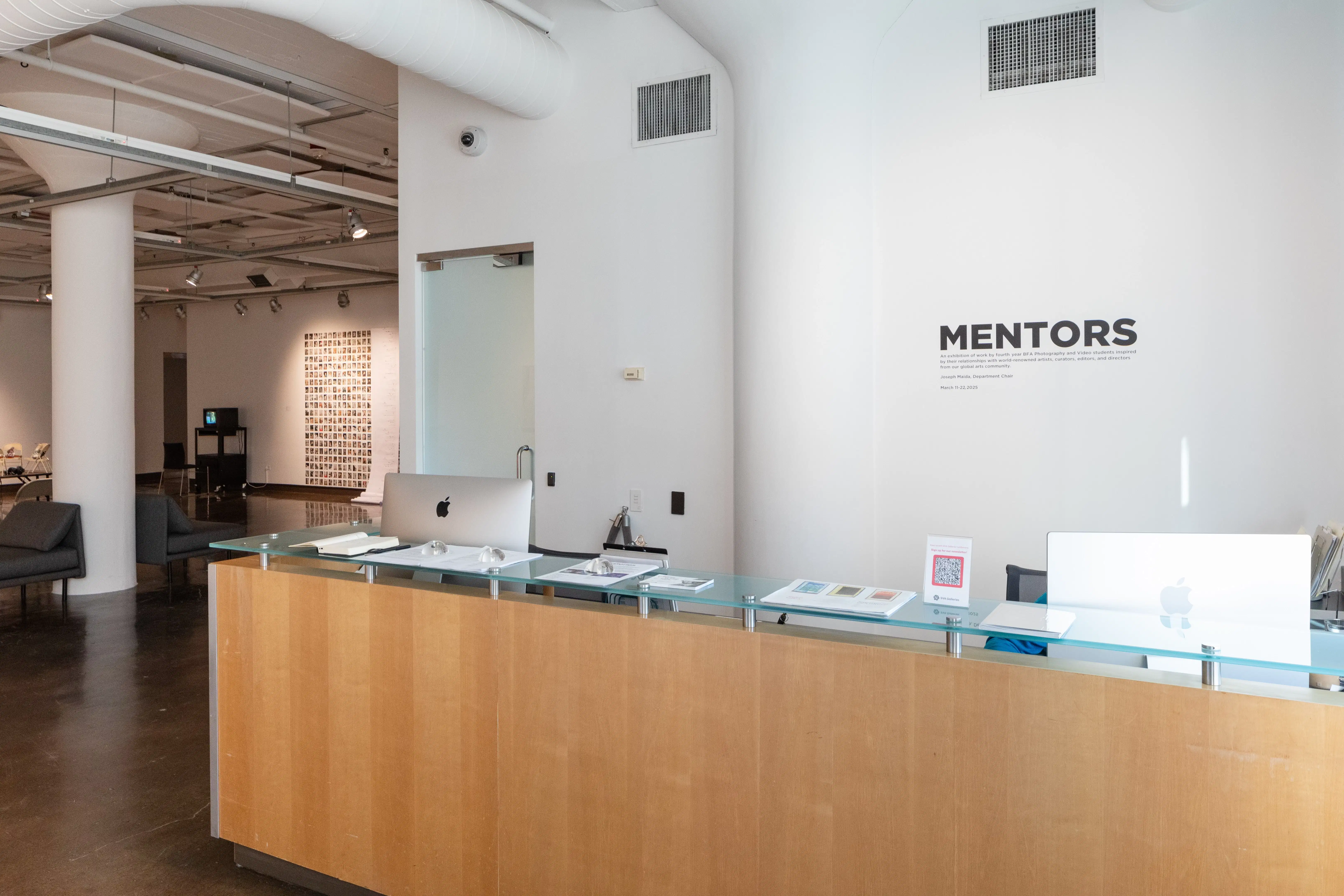 photo of front desk and vinyl text at SVA chelsea gallery
