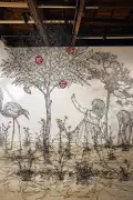 A three-dimensional installation on a white wall constructed with thin black plastic sticks that creates the illusion of a 2D drawing in three-dimensional space. Against a white background, this minimalist piece features sleek black linear elements depicting an apple tree surrounded by bushes, with a girl reaching for an apple on the right side.