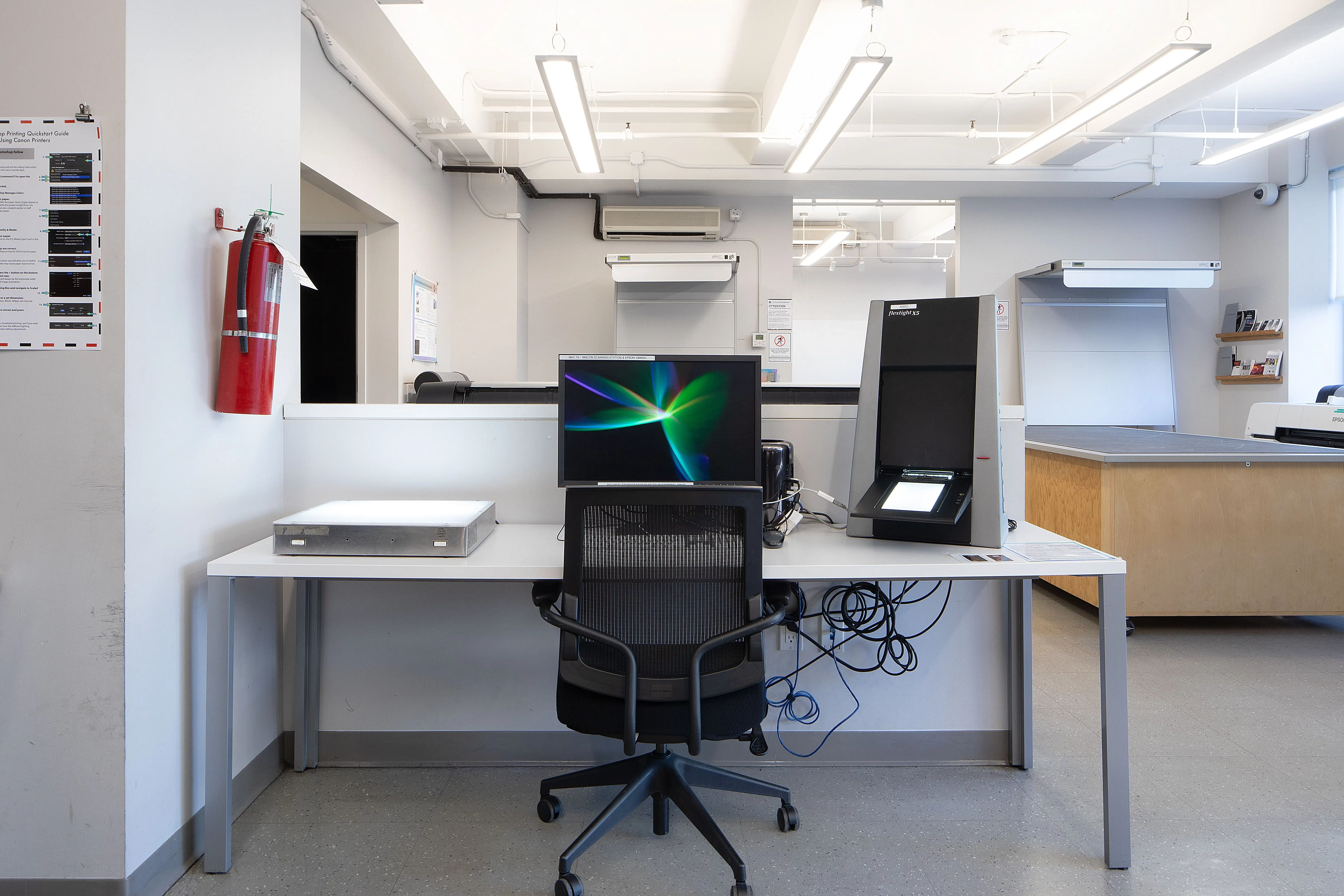 A work station with a monitor and scanner