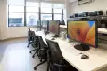 A classroom of monitors and scanners