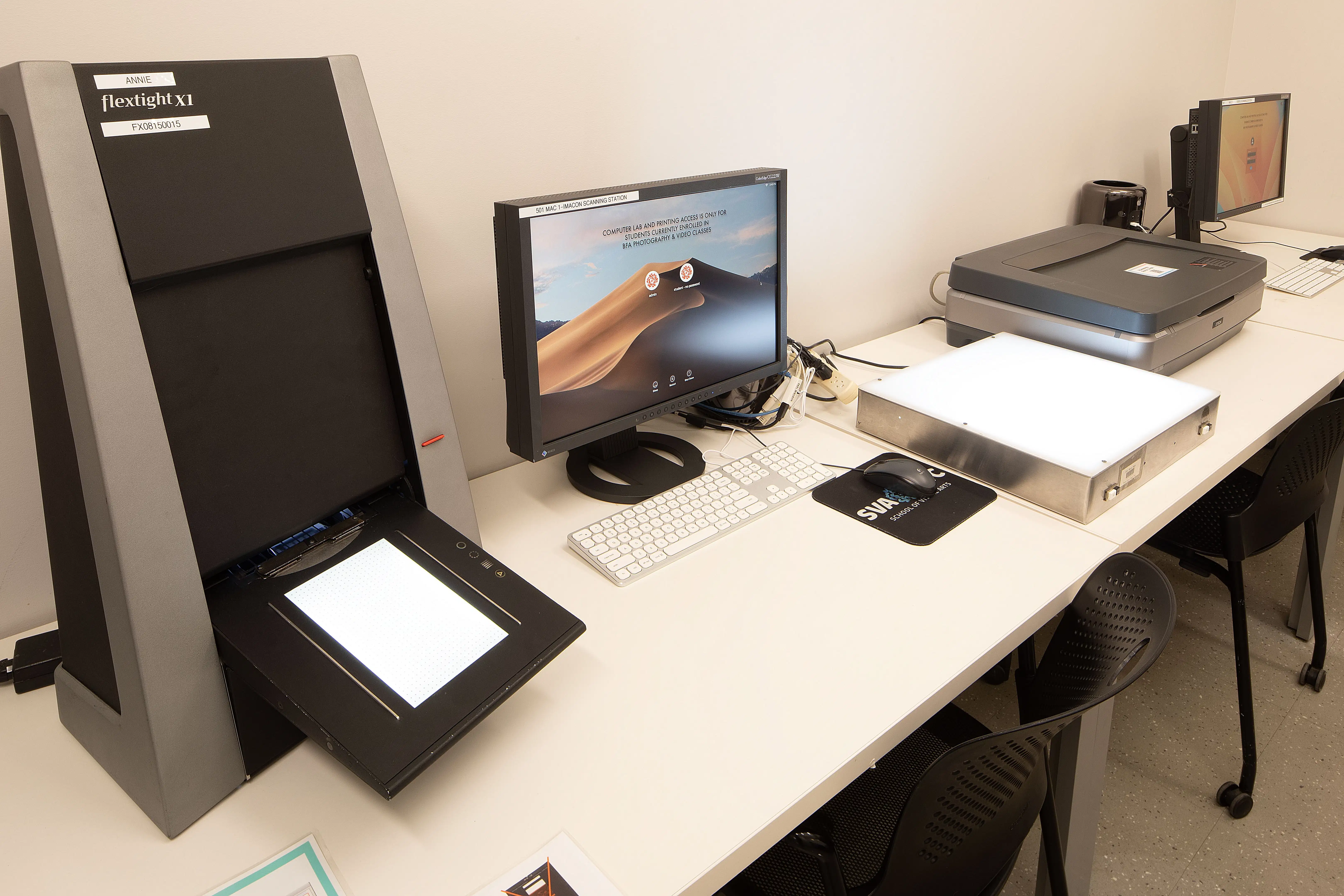 A work station with a monitor and scanner