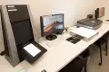 A work station with a monitor and scanner